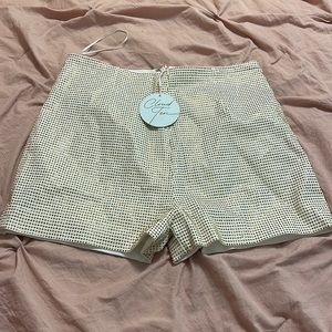 White shorts with gold rhinestones